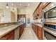 Modern kitchen with stainless steel appliances, granite countertops, and abundant storage space for the discerning chef at 20609 N Canyon Whisper Dr, Surprise, AZ 85387