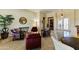 Comfortable living area featuring plush seating, stylish decor, and a bright, airy atmosphere at 20609 N Canyon Whisper Dr, Surprise, AZ 85387