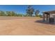 This backyard features a new block wall and a covered patio view of the house at 2136 W Pickett Ct, San Tan Valley, AZ 85144