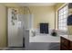 A bathroom featuring a tub, shower, and yellow walls at 2136 W Pickett Ct, San Tan Valley, AZ 85144