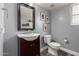 Charming bathroom featuring a dark vanity and framed mirror at 2136 W Pickett Ct, San Tan Valley, AZ 85144