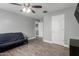 Spare bedroom has a futon and tile floors at 2136 W Pickett Ct, San Tan Valley, AZ 85144