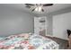 Bright bedroom with a ceiling fan and hallway access at 2136 W Pickett Ct, San Tan Valley, AZ 85144