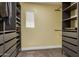 Walk-in closet featuring custom shelving and drawers for optimal storage at 2136 W Pickett Ct, San Tan Valley, AZ 85144