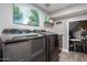 A laundry room with gray walls and a painting of a mountain lake at 2136 W Pickett Ct, San Tan Valley, AZ 85144