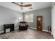Living room with chair, wood tile flooring, and a ceiling fan at 2136 W Pickett Ct, San Tan Valley, AZ 85144
