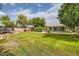 Large backyard with lush grass, a pool, and plenty of space for outdoor activities at 2448 S Salida Del Sol --, Chandler, AZ 85286