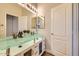 The modern bathroom boasts double sinks, a large mirror, and stylish fixtures at 2448 S Salida Del Sol --, Chandler, AZ 85286