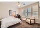 Cozy bedroom with neutral tones, a desk, and a comfortable chair near shuttered windows at 2448 S Salida Del Sol --, Chandler, AZ 85286
