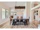 Elegant dining room with a wooden table, pendant lighting, and comfortable seating for Gathering gatherings at 2448 S Salida Del Sol --, Chandler, AZ 85286