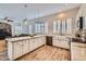 Bright kitchen featuring a white marble countertop, stainless steel appliances, and open layout connecting to the living room at 2448 S Salida Del Sol --, Chandler, AZ 85286