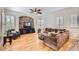 Inviting living room with hardwood floors, a brick accent wall, and ample seating at 2448 S Salida Del Sol --, Chandler, AZ 85286