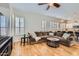 Comfortable living room with a large sectional sofa and hardwood floors at 2448 S Salida Del Sol --, Chandler, AZ 85286