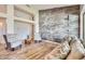Comfortable living room with stylish seating, a wooden accent wall, and a warm, inviting atmosphere at 2448 S Salida Del Sol --, Chandler, AZ 85286