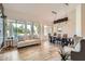 Sunlit living room with a view of the pool, featuring a dining area and comfortable seating arrangement at 2448 S Salida Del Sol --, Chandler, AZ 85286