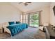 Serene main bedroom with a sliding glass door leading to the backyard and plush carpet at 2448 S Salida Del Sol --, Chandler, AZ 85286