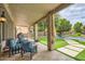 The covered patio offers comfortable seating and a view of the backyard and pool at 2448 S Salida Del Sol --, Chandler, AZ 85286