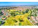Stunning aerial view showcasing the community's lush golf course, serene waterways, and beautiful homes at 2673 Leisure World --, Mesa, AZ 85206