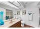Bright bathroom boasts wood floors, a shower, and well-lit vanity at 2673 Leisure World --, Mesa, AZ 85206