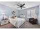 Comfortable bedroom features plush carpet, ceiling fan, and shuttered window at 2673 Leisure World --, Mesa, AZ 85206