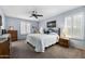 Comfortable bedroom features plush carpet, ceiling fan, and shuttered windows at 2673 Leisure World --, Mesa, AZ 85206
