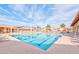 Large, inviting community pool area with a spacious deck, comfortable seating, and well-maintained facilities at 2673 Leisure World --, Mesa, AZ 85206