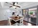 Eat-in kitchen with hardwood floors, modern lighting and a view of the patio at 2673 Leisure World --, Mesa, AZ 85206