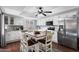 Bright kitchen with white cabinets, stainless steel appliances and a large eat-in table at 2673 Leisure World --, Mesa, AZ 85206