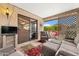 Covered patio with comfortable wicker furniture and an outdoor dining set at 2673 Leisure World --, Mesa, AZ 85206