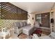 Covered patio features comfortable wicker furniture and privacy lattice at 2673 Leisure World --, Mesa, AZ 85206