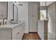 Elegant bathroom featuring a double vanity with marble countertop and unique patterned tile flooring at 2814 N 62Nd N St, Scottsdale, AZ 85257