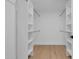 Spacious walk-in closet with custom shelving and rods for optimal organization at 2814 N 62Nd N St, Scottsdale, AZ 85257