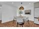 Bright dining space featuring a stylish round table, upholstered chairs, and terracotta tiled flooring at 2814 N 62Nd N St, Scottsdale, AZ 85257