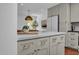 Close-up of a kitchen island with white countertops and drawers, adjacent to the dining area with stylish accents at 2814 N 62Nd N St, Scottsdale, AZ 85257