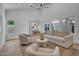 Bright living room with a high ceiling, neutral furniture, and views into the dining area and exterior at 2814 N 62Nd N St, Scottsdale, AZ 85257