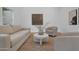 Serene living room showcasing neutral tones, comfortable seating, and natural light, ideal for relaxation at 2814 N 62Nd N St, Scottsdale, AZ 85257