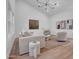 Bright and airy living area with neutral-colored furnishings, stylish decor, and views of the outdoor space at 2814 N 62Nd N St, Scottsdale, AZ 85257