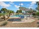 Community pool with lounge chairs and umbrellas surrounded by trees and manicured landscaping at 2814 N 62Nd N St, Scottsdale, AZ 85257