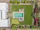 Aerial view of backyard oasis featuring pool, putting green, and outdoor seating at 30271 N 117Th Dr, Peoria, AZ 85383