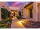 View of the home's front walkway with desert landscaping, lighting and the home's front door at 30271 N 117Th Dr, Peoria, AZ 85383