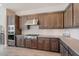 Well-equipped kitchen with stainless steel appliances, custom cabinets, and modern finishes at 30271 N 117Th Dr, Peoria, AZ 85383
