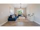 Stylish living room featuring blue couches, modern decor and a neutral color palette at 30271 N 117Th Dr, Peoria, AZ 85383