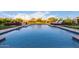 Relaxing pool area with lounge chairs, water features, and lush landscaping at 30271 N 117Th Dr, Peoria, AZ 85383