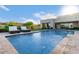 Backyard pool offers space for relaxation and entertaining near patio at 30271 N 117Th Dr, Peoria, AZ 85383