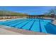 Sparkling community pool with swimming lanes, a covered pergola and a playground for hours of summer fun at 30271 N 117Th Dr, Peoria, AZ 85383