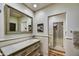Charming bathroom featuring a decorative mirror, a tile backsplash, and a glass-enclosed shower at 3086 S First Water Ln, Gold Canyon, AZ 85118