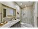 Stylish bathroom showcasing a glass shower, modern vanity, and decorative tile at 3086 S First Water Ln, Gold Canyon, AZ 85118