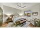 Inviting bedroom with a comfortable king bed, natural light, and a view of the neighborhood at 3086 S First Water Ln, Gold Canyon, AZ 85118