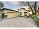 Beautiful home showcasing desert landscaping, a paved driveway, and a two-car garage, offering curb appeal at 3086 S First Water Ln, Gold Canyon, AZ 85118