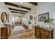 Bright home foyer featuring wood floors, beamed ceilings, and elegant furnishings and decor at 3086 S First Water Ln, Gold Canyon, AZ 85118